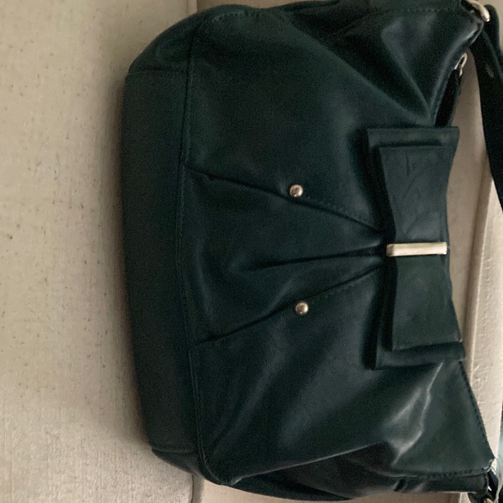 Small, teal colored Elle purse. Shoulder purse. Used, like new. Polka dot lining